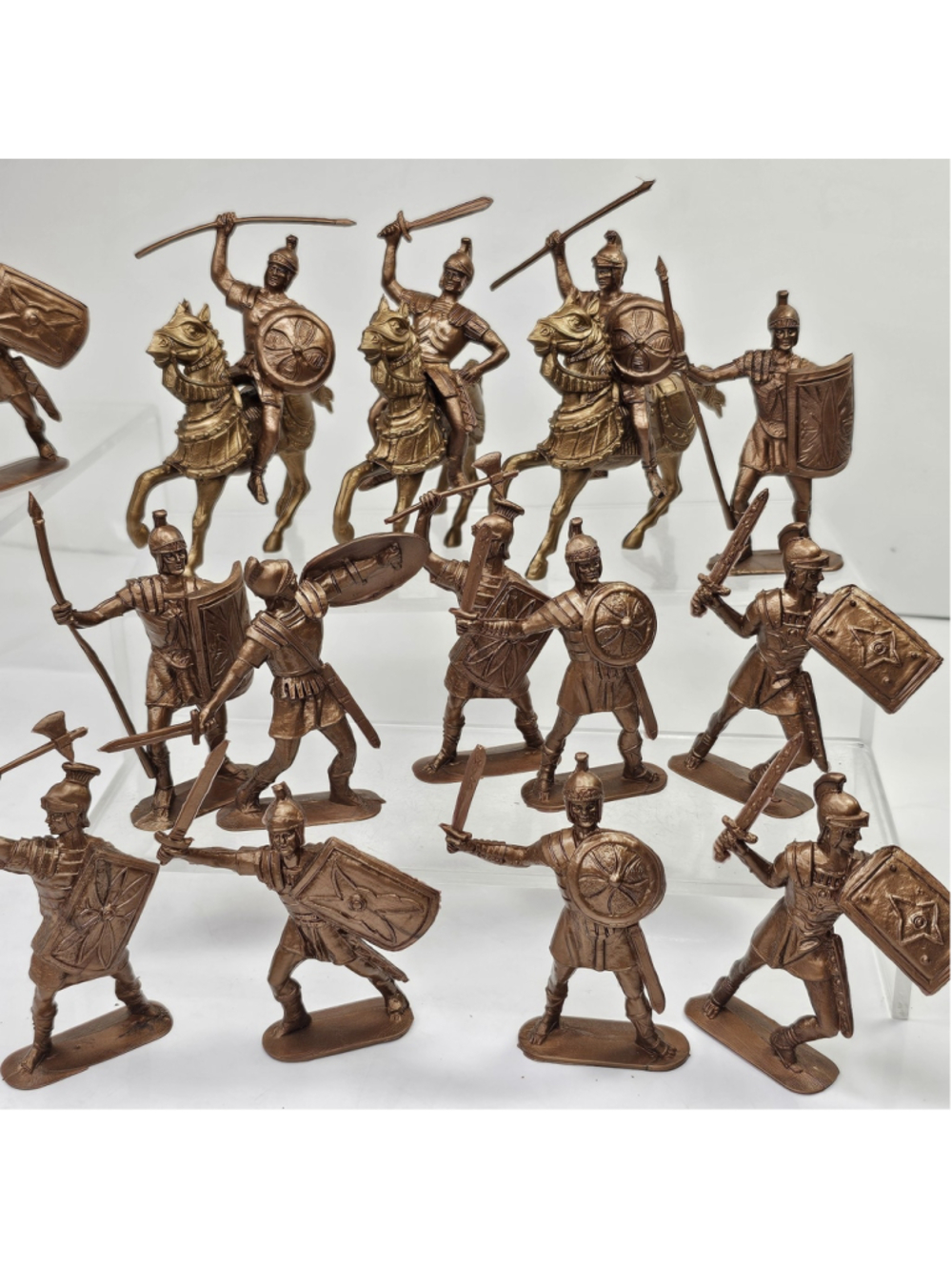 Vintage mixed lot of toy soldier and warrior figures featuring Roman Soldiers
